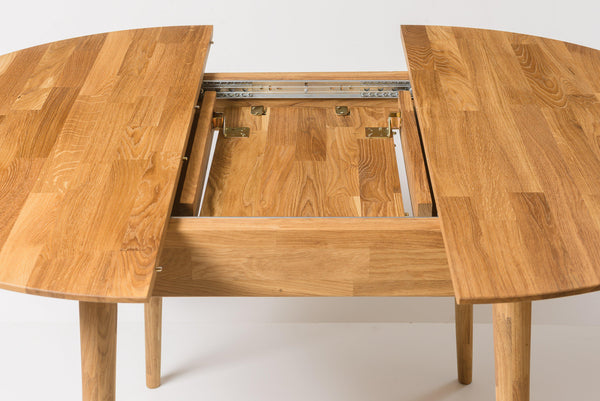 Tavolo da pranzo rotondo allungabile 110-158x110 cm con piano rovere  nordico e gambe nere - Daina